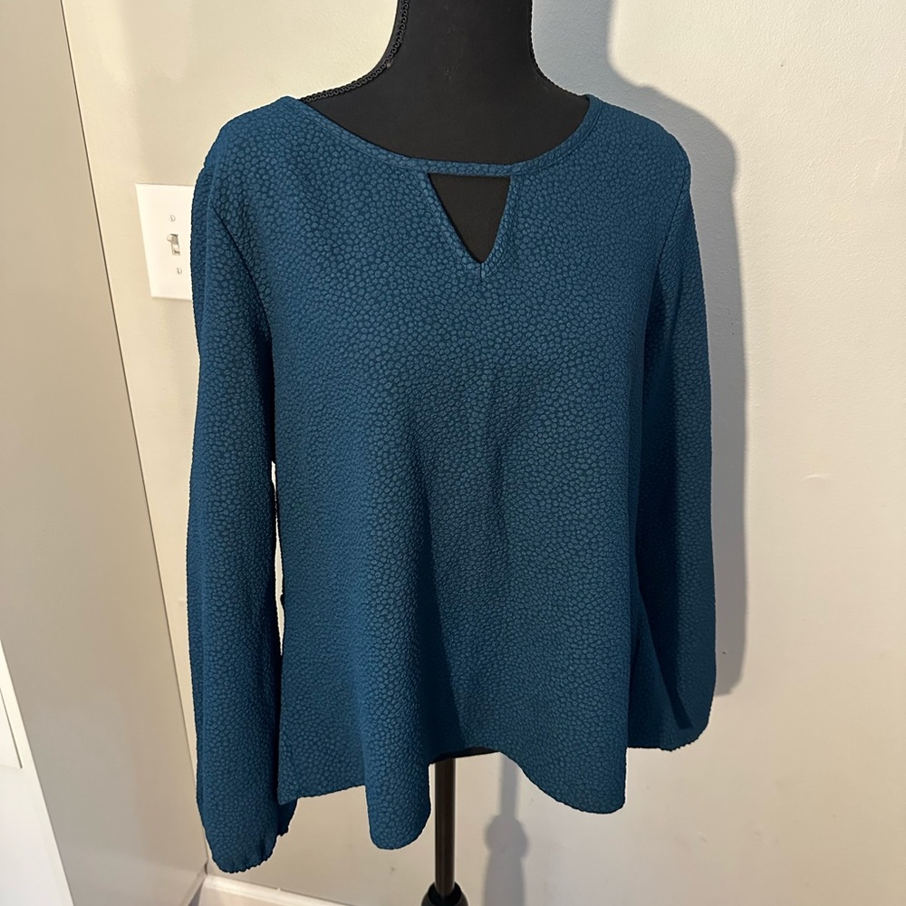 Xhiliration. Size XL green top with cut outs and neckline. Long sleeves